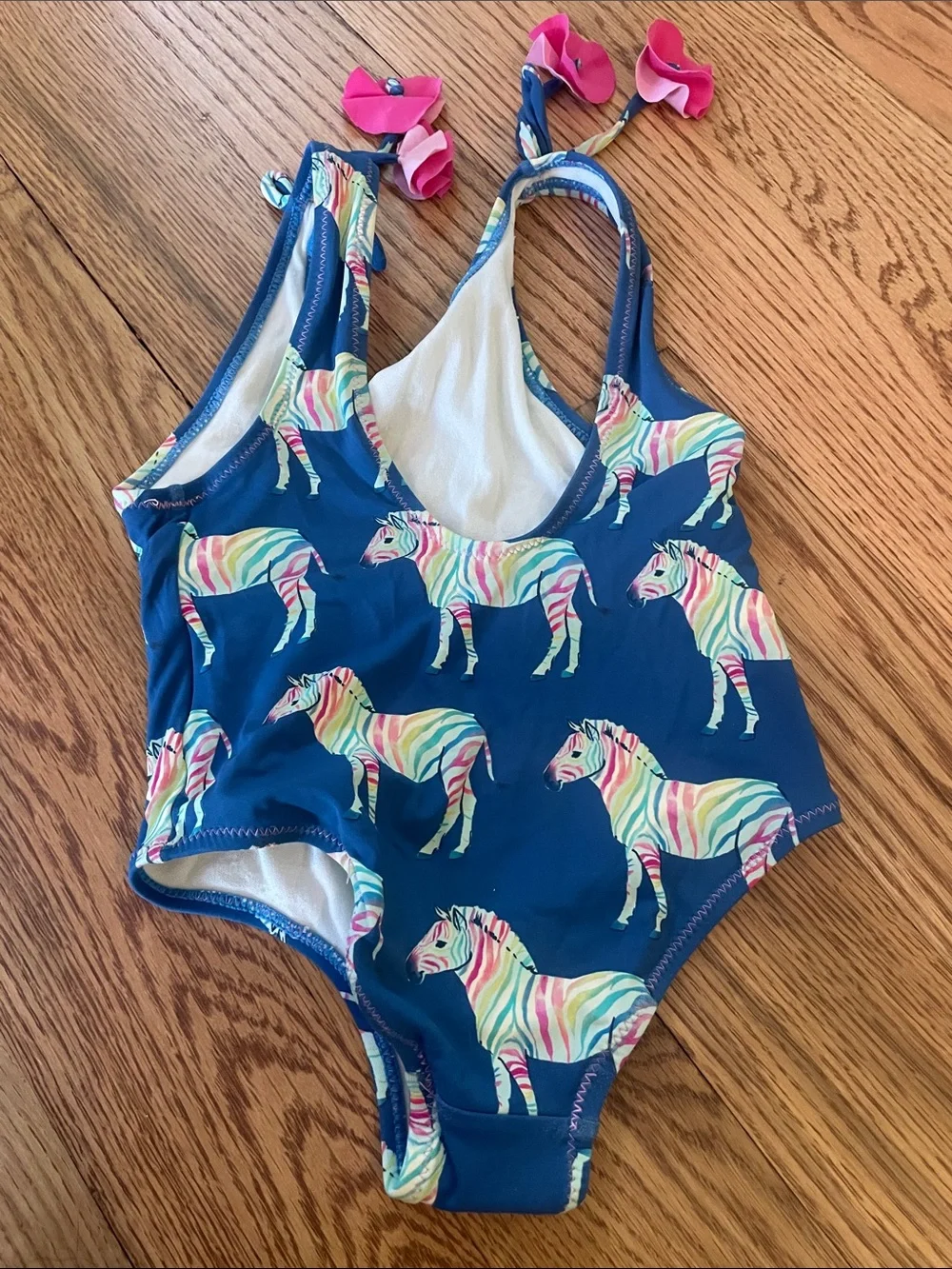 Hatley Navy One-Piece Swimsuit with Multicolor Zebra Print and Pink Tie Accents